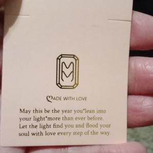 Mumreues Earrings with a Rose on each.